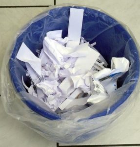 Paper in recycling bin